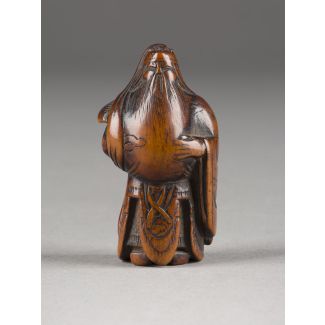 Ein netsuke von kan'u aus holz