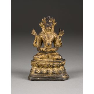 Eine vergoldete sitzende figur des amitayus aus bronze