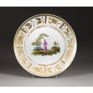 A PORCELAIN PLATE WITH A PASTORAL SCENE 