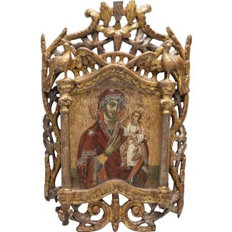 AN ICON SHOWING THE HODIGITRIA MOTHER OF GOD IN A CARVED WOODEN FRAME 