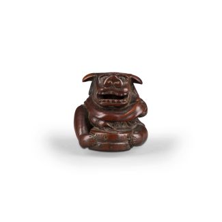 Ein Netsuke eines Shishimai-Darstellers aus Holz