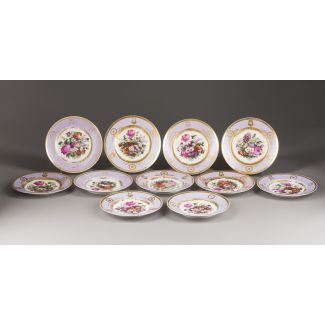A SET OF ELEVEN PORCELAIN PLATES WITH FLOWER DECOR 