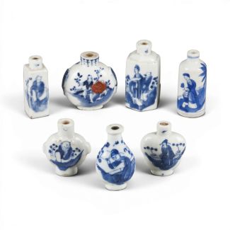 SEVEN BLUE AND WHITE SNUFF BOTTLES WITH CHARACTER DESIGNS