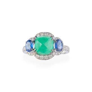Emerald cabochon ring surrounded by sapphires and diamonds