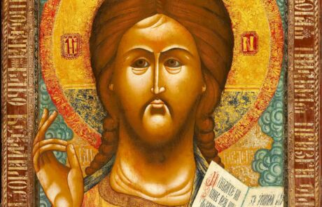 Detailreich gestaltetes Ikone von Jesus Christus mit Segensgeste und Heiliger Schrift, umrandet von kunstvollen Mustern.